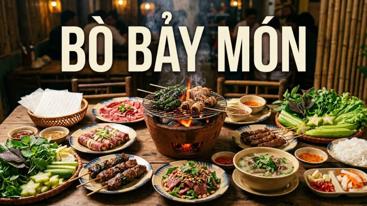 Bò Bảy Món vietnamita con sette preparazioni di manzo disposte attorno a una griglia a carbone con erbe fresche e carta di riso