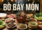Bò Bảy Món vietnamita con sette preparazioni di manzo disposte attorno a una griglia a carbone con erbe fresche e carta di riso