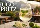 Hugo Spritz con prosecco ghiaccio menta fresca e lime servito freddo su una terrazza estiva