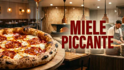 Pizza contemporanea con miele piccante al peperoncino versato su mozzarella salame e cornicione