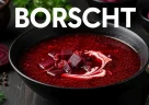 Borscht ucraino dal colore rosso intenso servito con panna acida e aneto fresco